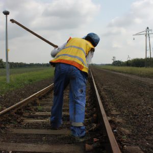 Person working on railroad tracks