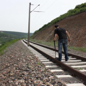 Person inspecting railway tracks